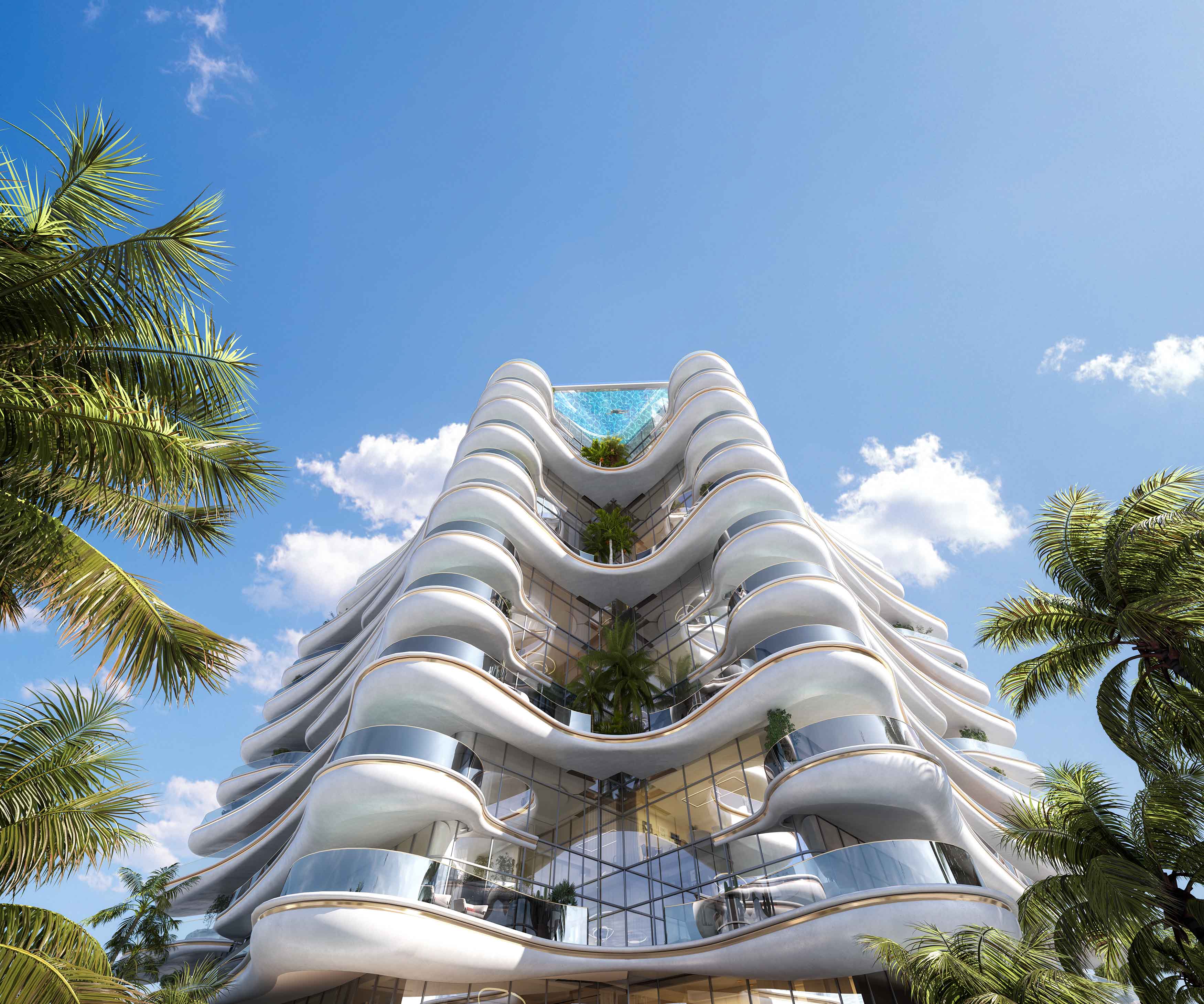 Beach Walk Grand By Imtiaz A modern building with a wavy facade, surrounded by palm trees and under a blue sky with clouds.